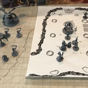 On the left, demons move towards the portal gateway -- on the right, the players fight Liam and a skeleton army in a race against time to close the portal!